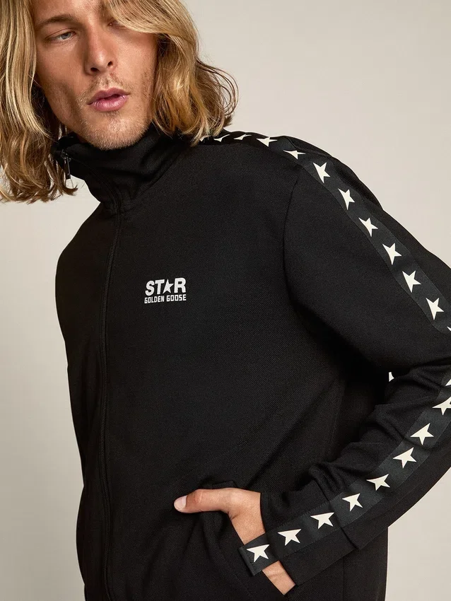 Sudadera negra con cremallera para hombre y estrellas blancas