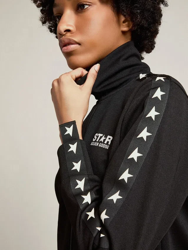 Sudadera negra con cremallera para mujer y estrellas blancas