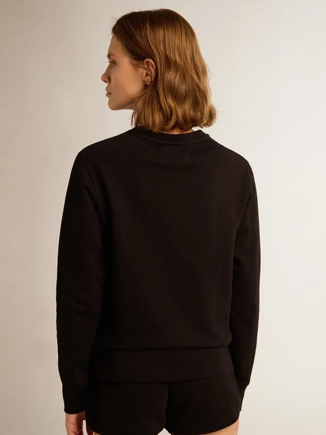 Sudadera negra de la Star Collection con una estrella tono sobre tono en la parte delantera