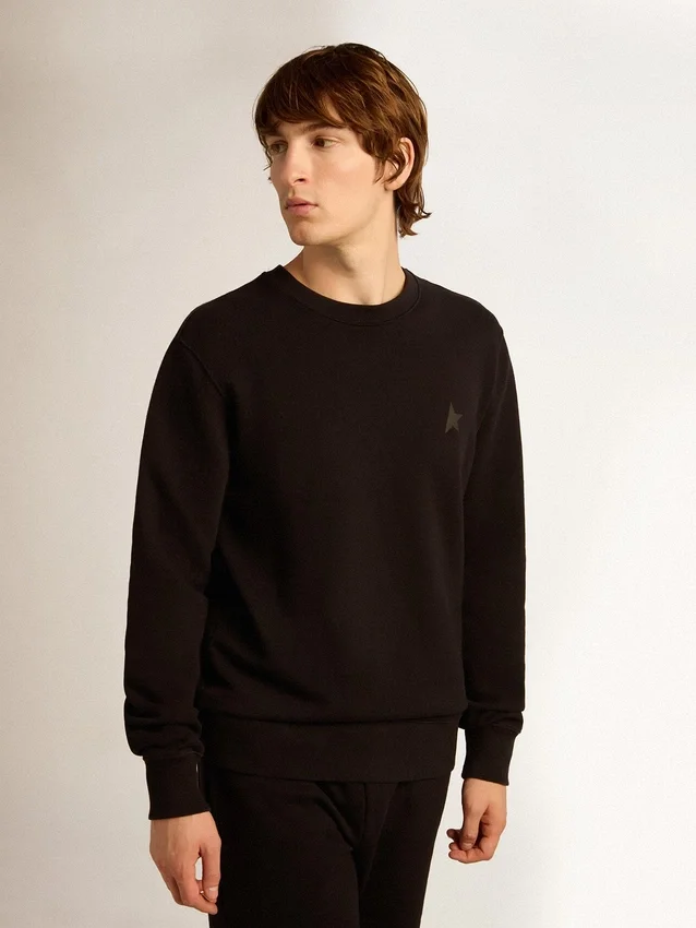 Sudadera negra de la Star Collection con una estrella tono sobre tono en la parte delantera