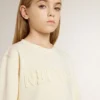 Sudadera para niñas de color crema con letras en parche