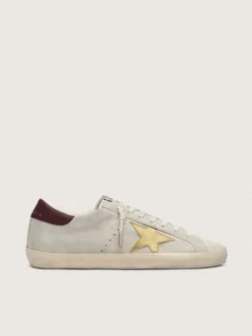 Super-Star CNY para mujer en ante marfil con estrella de piel metalizada y lengüeta de piel en el talón