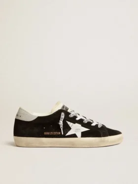 Super-Star LTD para mujer en ante negro con estrella estampada en blanco y lengüeta del talón con purpurina plateada