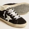 Super-Star LTD para mujer en ante negro con estrella estampada en blanco y lengüeta del talón con purpurina plateada
