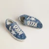 Super-Star LTD para mujer en denim azul claro con una estrella de piel blanca y flores bordadas