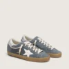 Super-Star para hombre en ante gris con estrella de piel blanca y lengüeta trasera de piel plateada