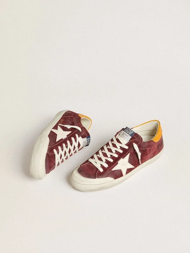 Super-Star para hombre en ante rojo ladrillo con estrella de piel blanca y lengüeta en el talón con estampado animal