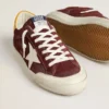 Super-Star para hombre en ante rojo ladrillo con estrella de piel blanca y lengüeta en el talón con estampado animal