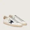 Super-Star para hombre en piel blanca con estrella de lona azul medianoche y lengüeta del talón en piel color tabaco