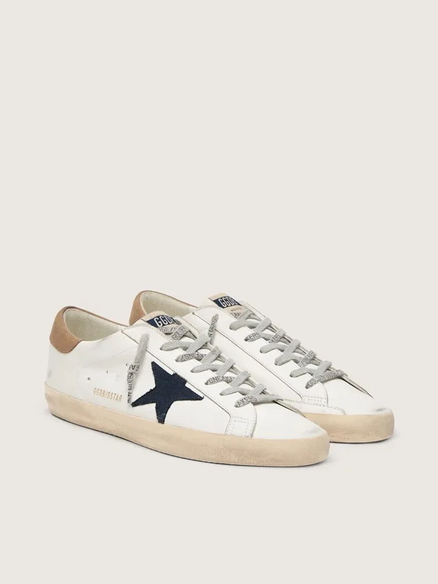 Super-Star para hombre en piel blanca con estrella de lona azul medianoche y lengüeta del talón en piel color tabaco
