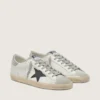 Super-Star para hombre en piel blanca con estrella de nubuck negro y lengüeta del talón de piel metalizada plateada
