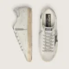 Super-Star para hombre en piel blanca con estrella de nubuck negro y lengüeta del talón de piel metalizada plateada