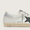 Super-Star para hombre en piel blanca con estrella de nubuck negro y lengüeta del talón de piel metalizada plateada