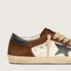 Super-Star para hombre en piel blanca y ante marrón con estrella de piel negra