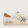 Super-Star para mujer en napa con estrella plateada brillante y letras por toda la superficie