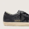 Super-Star para mujer en purpurina negra con estrella de ante negro e inserciones de piel