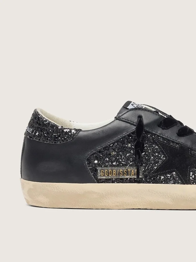 Super-Star para mujer en purpurina negra con estrella de ante negro e inserciones de piel