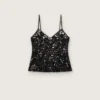Top de mujer de tul negro con estampado floral de lentejuelas negras