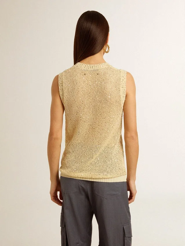Top de punto de malla con lentejuelas y detalles en contraste