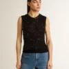 Top de punto de malla negro con lentejuelas y detalles en contraste