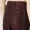 Vaqueros de mujer en denim burdeos con cristales degradados