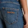 Vaqueros de niños con bordes sin rematar y bordado