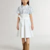 Vestido de camisa para niñas en lona de algodón blanca con estampado náutico azul y ribete blanco