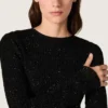 Vestido largo de mujer de malla negra con lentejuelas negras