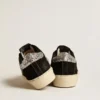 Zapatillas Hi Star para mujer en piel negra con lengüeta del talón con purpurina plateada