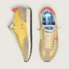Zapatillas Marathon para mujer con parte superior de nailon amarillo y estrella naranja