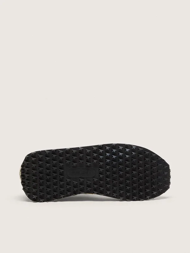 Zapatillas Marathon para mujer con parte superior de nailon amarillo y estrella naranja