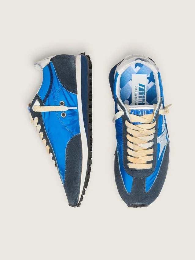 Zapatillas Marathon para mujer con parte superior de nailon azul y estrella blanca