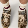 Zapatillas Marathon Speed para hombre en piel de potro con estampado de leopardo en tonos beige y negro, con estrella de piel negra