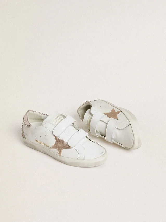 Zapatillas Old School LTD para mujer con estrella y lengüeta en el talón de piel metalizada en oro rosa