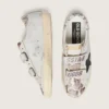 Zapatillas Old School para mujer en piel blanca con estrella de piel negra e inserciones con estampado de serpiente