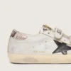 Zapatillas Old School para mujer en piel blanca con estrella de piel negra e inserciones con estampado de serpiente