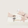 Zapatillas para bebé en napa con estrella de ante rosa y estampado de mascota