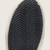 Zapatillas Slide para mujer en negro y purpurina plateada con estrella de cuero y detalles metalizados