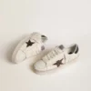 Zapatillas Stardan para mujer en piel blanca con estrella marrón brillante y lengüeta en el talón