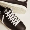 Zapatillas Starter para hombre de piel con estrella estampada en la lengüeta del talón