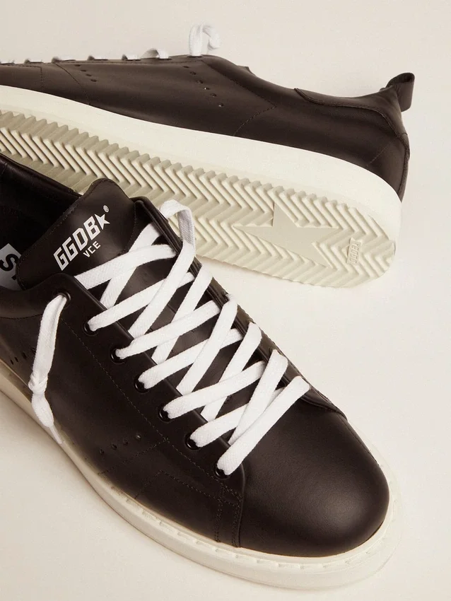 Zapatillas Starter para hombre de piel con estrella estampada en la lengüeta del talón