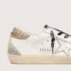 Zapatillas Super-Star de piel blanca para mujer con lengüeta dorada brillante en el talón