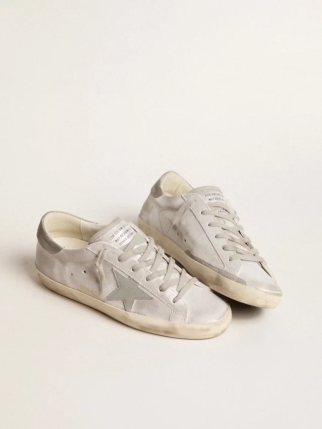 Zapatillas Super-Star en piel gris-blanca con efecto purpurina y estrella de piel