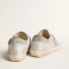 Zapatillas Super-Star en piel gris-blanca con efecto purpurina y estrella de piel