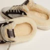 Zapatillas Super-Star Sabot para mujer en piel laminada plateada con estrella negra