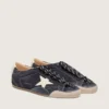 Zapatillas True-Star para mujer en ante azul oscuro con estrella y lengüeta en el talón de piel napa blanca