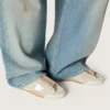 Zapatillas True-Star para mujer en ante gris claro con estrella plateada metalizada y lengüeta en el talón