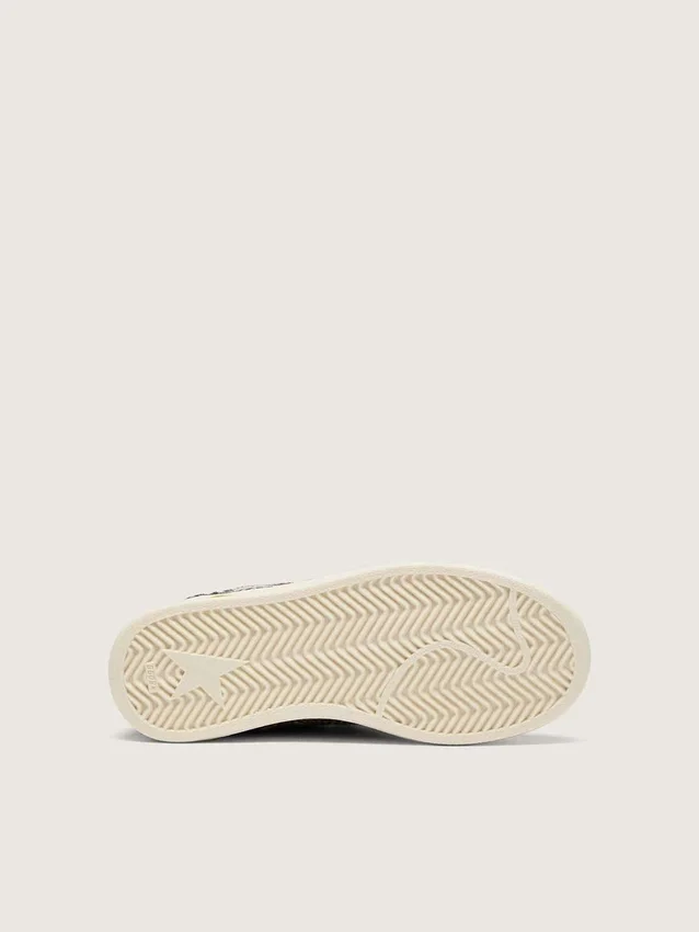 Zapatillas «Young Ball Star» en piel de potro con estampado de leopardo en blanco y negro y estrella de cuero color crema