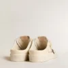 Zapatos tipo sabot «Ball Star» en napa marfil con estrella de purpurina bronce